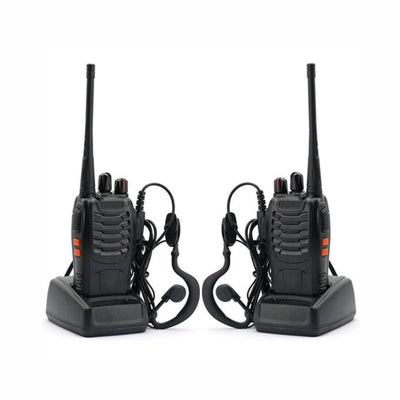 Two black walkie-talkies with headsets on a white background